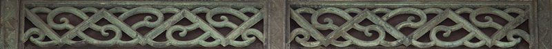 Oxidized copper latticework on window of BW building