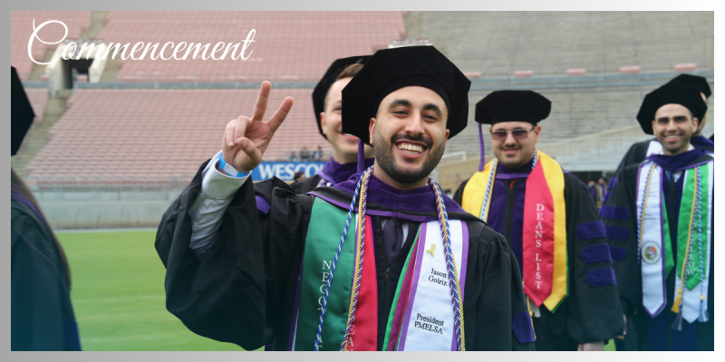 Student in cap and gown making a peace sign