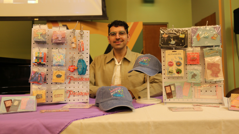 Barkev Msrlyan with the Merch Motel merchandise display