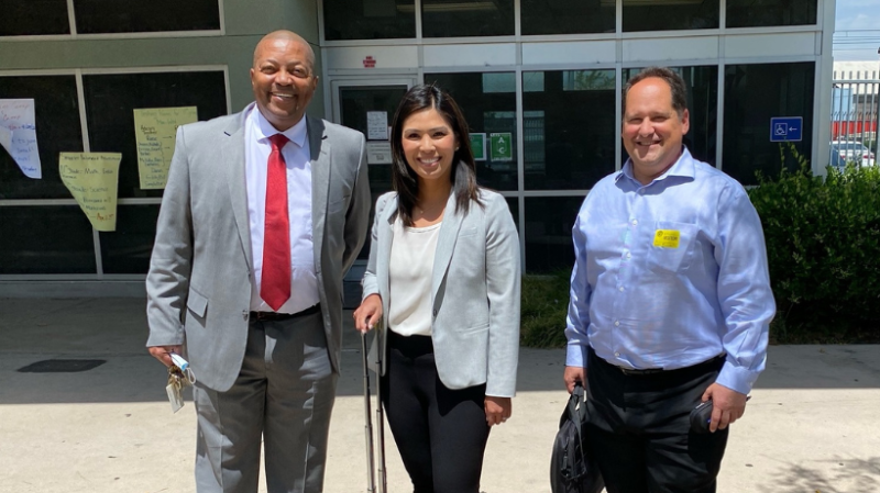 Dorsey HS Instructor Donald Singleton with Attorney Volunteers Eric Blum and Nikki Fermin