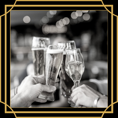 Four hands toasting with beer glasses