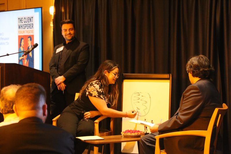 Professor Arman Avagyan ’22 moderates The Forum Theater segment.