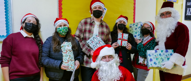 LLSA volunteers in Santa hats at Hoover Elementary