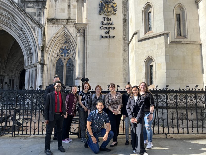 Professors Kevin Greene and Orly Ravid with students in front of the Royal Courts of Justice