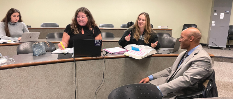 Stephanie Anderson studying with classmates