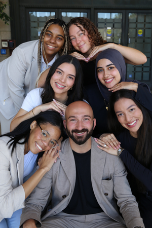 SCALE students with their heads stacked and smiling