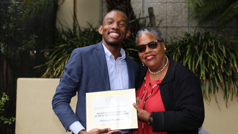 Donald Bullock holding his award with Prof. Gunning