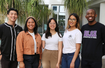 Group photo of five Southwestern students smiling at camera