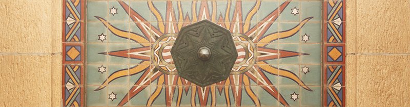 Mosaic tile above light fixture seen from below